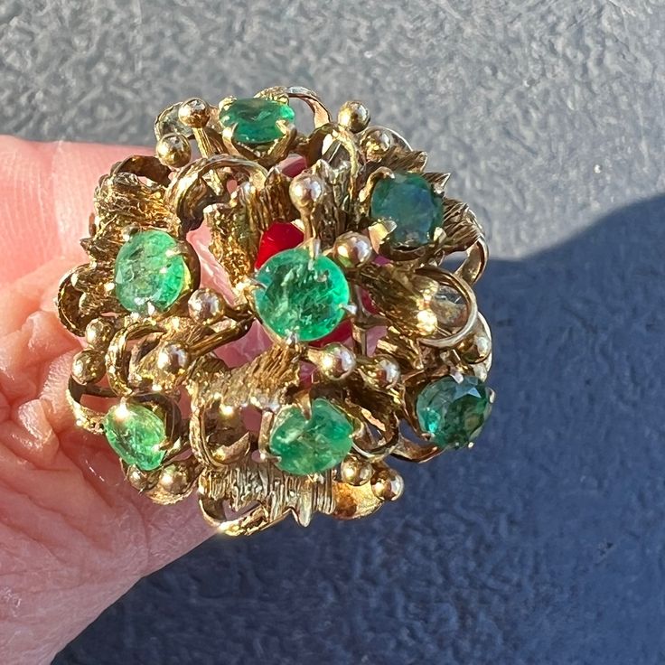 Absolutely Beautiful Bombe Style Ring, Featuring 7 Bright Emeralds In A Branch/ Leaf Design Setting. The Ring Is A Solid 14k Yellow Gold (Stamped And Tested), Also Bears A Makers Stamp Of A Crest And 2 Letters. Its Sits Approximately 15mm High Above Finger, Size 6.25 On Ring Mandrel And Weights A Solid 6.7 Grams. Although The Shank Of The Ring Is Not Done In The Brutalist Style , The Top Of The Ring Is Very Much Reminds Of That Very Popular 1950's-1960's Brutalist Style.Really Well , Heavy , Sol Formal 14k Gold May Birthstone Cluster Ring, Estate Style Round Jewelry Gift, Estate White Gold Jewelry As A Gift, Estate 14k Gold Jewelry For Anniversary, Estate Style White Gold Jewelry As Gift, Collectible Yellow Gold May Birthstone Ring, Multi-stone Emerald Ring For Formal Occasions In May, Collectible May Birthstone Yellow Gold Ring, Yellow Gold May Birthstone Collectible Ring