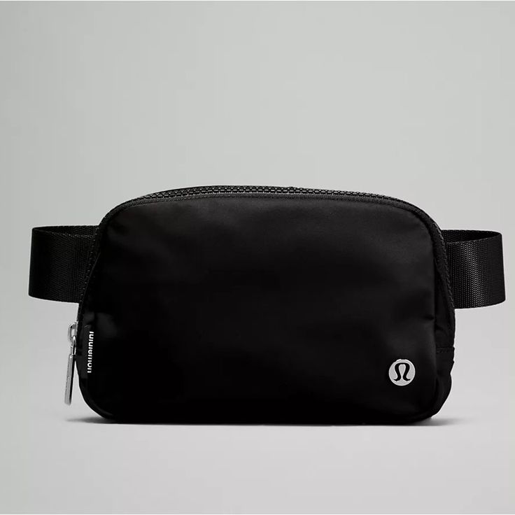 Brand New, Still In Plastic Blk Lululemon Everywhere Belt Bag. Great For On The Go Travel. Can Be Use Across The Waist Or As A Crossbody Bag. Exterior Zippered Pocket To Secure Your Valuables. Interior Pockets Hold The Essentials. Bag Dimensions: 19cm X 5.5cm X 13cm (7.5" X 2" X 5") Volume: 1l Strap Length When Fully Extended: 16cm (41.7”) Questions? Leave A Comment Below! Lululemon Bags, Lululemon Everywhere Belt Bag, Everywhere Belt Bag, Pocket Storage, Festival Bag, Black Crossbody, Metallic Logo, Black Belt, Bag Straps