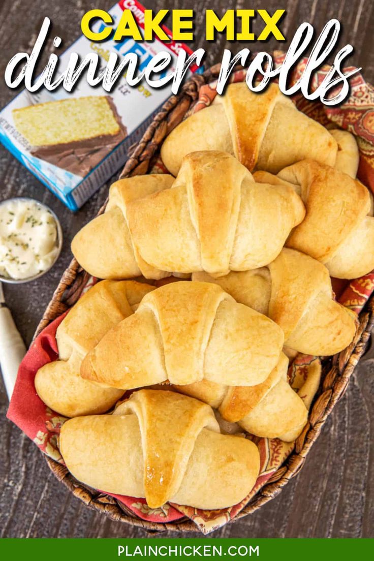 a close up of bread in a basket with the words cake mix dinner rolls on it