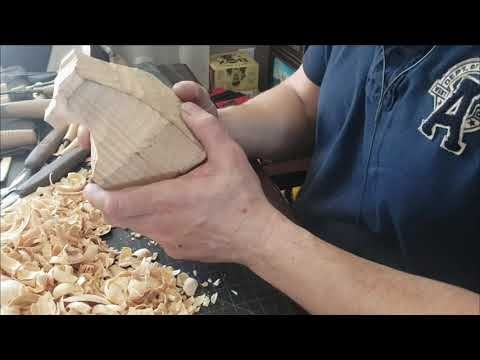 a man is working with wood shavings