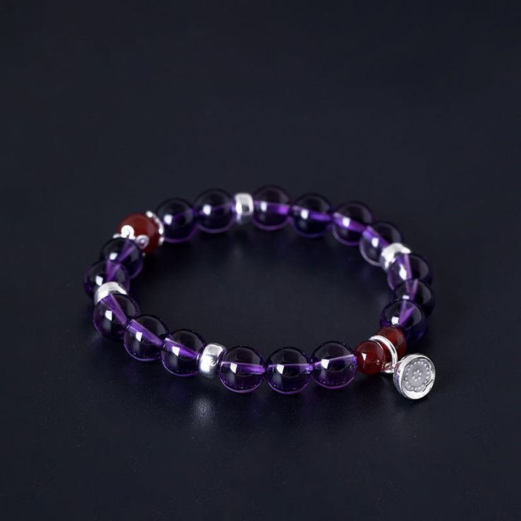 Crafted with 925 silver and adorned with an elegant amethyst lotus charm, this bracelet exudes a timeless sophistication. The amethyst is known for its calming and healing properties, making this bracelet not only a beautiful accessory but also a potential source of positive energy. Tarnish proof Water proof Sleep / Nap proof Safe for sensitive skin Wear it while working out &showering Designed to wear 24/7 If there is no stock, the product will take 15 days to produce Please leave your usual em Elegant Crystal Gemstone Bracelet For Meditation, Silver Amethyst Bracelets With Round Beads, Elegant Purple Crystal Bracelet For Healing, Elegant Purple Crystal Bracelet For Meditation, Elegant Purple Crystal Meditation Bracelet, Spiritual Sterling Silver Gemstone Bracelet, Spiritual Sterling Silver Bracelet With Natural Stones For Healing, Spiritual Sterling Silver Gemstone Bracelet For Healing, Elegant Healing Charm Bracelet With Natural Stones