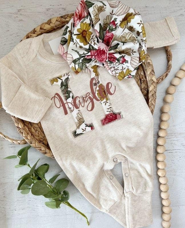 This sweet sleeper is soft and comfortable to snuggle a little one. This features a soft oatmeal romper, a large initial in a simplistic vintage floral of soft reds, pinks, and gold, with name in a pleasant pink color across the front. This outfit makes a perfect coming home outfit, newborn pictures, or baby shower gift.  Newborn fits approximately 6-8lbs 0/3 fits approximately 9-13lbs 3/6 fits approximately 12-16lbs Please leave name in the notes to seller box at checkout. Unless specified, the Cotton Onesie Gift For Spring, Personalized Fitted Onesie For Spring, Newborn Going Home Outfit, Anna Claire, Newborn Coming Home Outfit, Embroidered Items, Going Home Outfit, Newborn Romper, Personalized Baby Girl