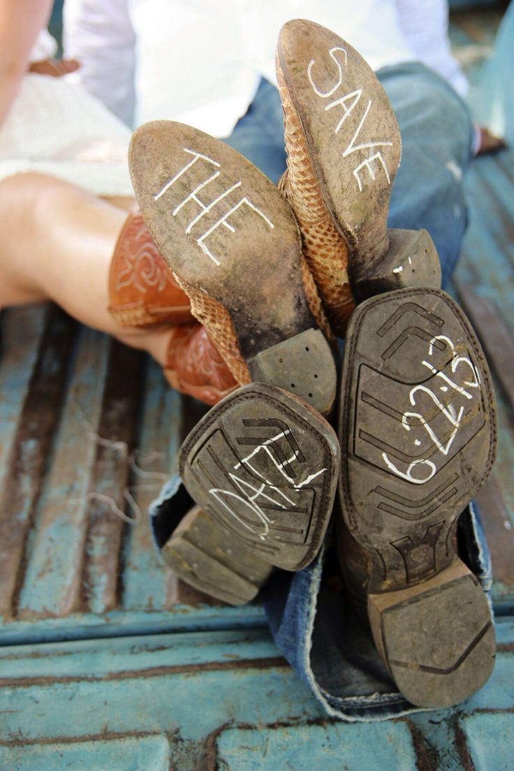 two pairs of shoes with writing on them sitting in the back of a pickup truck