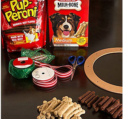 the dog is getting ready to make his own homemade treat with milk, cookies and candy