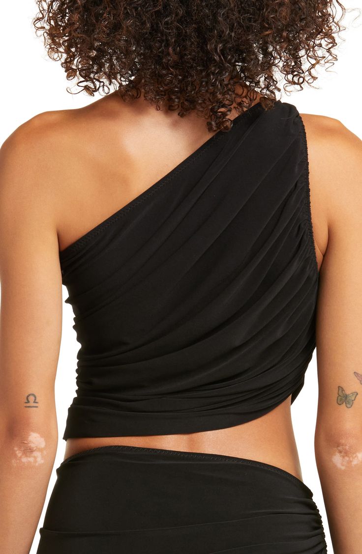 Make a splash in a Grecian-style swim top featuring a one-shoulder neckline and flattering ruched details at the front and back. One-shoulder neck Partially lined 95% polyester, 5% spandex Machine wash, dry flat Imported Ruched One Shoulder Stretch Top For Evening, Ruched Stretch One Shoulder Top For Evening, Summer One-shoulder Ruched Top For Night Out, Ruched One-shoulder Top For Night Out In Summer, Summer Ruched One Shoulder Top For Night Out, Ruched One Shoulder Top For Evening, Black Ruched One-shoulder Top For Summer, Black Ruched One Shoulder Top For Summer, Asymmetrical Ruched One Shoulder Top For Night Out