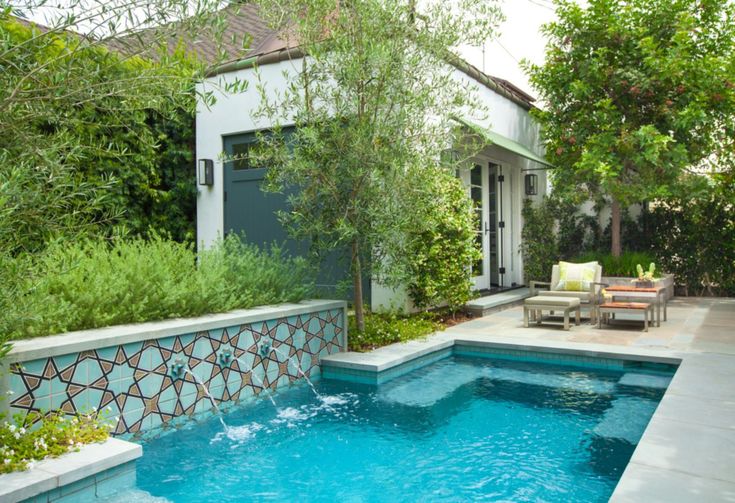 a small pool in the middle of a backyard