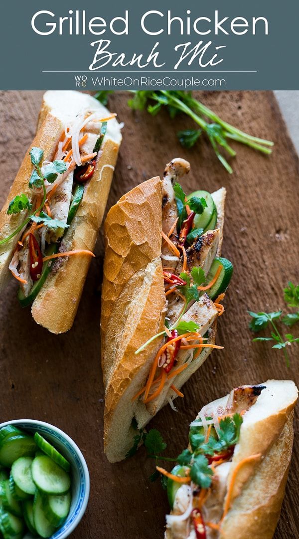 grilled chicken banh mi sandwich with cucumbers and sauce on the side