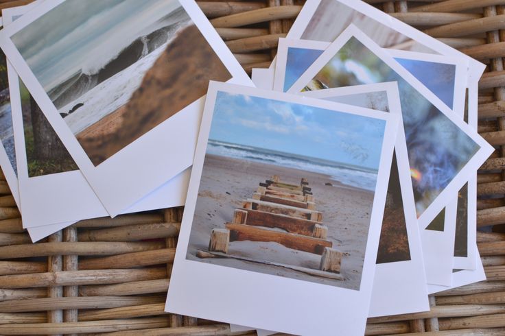 several pictures are placed on top of each other in a wicker basket next to the beach