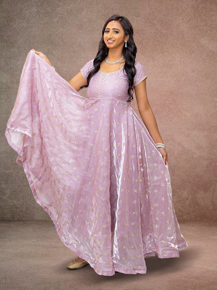 Embrace the luxurious touch of our Enchanting Anarkali Lavender Dress, crafted from fine organza and adorned with delicate gold flower work. This full-length dress is ideal for special events, offering a majestic look with every turn. Dry clean recommended. Key Specifications : Material Organza Occasion Festive Type Anarkali Dress Organza Anarkali, Lavender Dress, Lavender Dresses, Organza Dress, Full Length Dress, Gold Work, Anarkali Dress, Lavender Color, Gold Flower