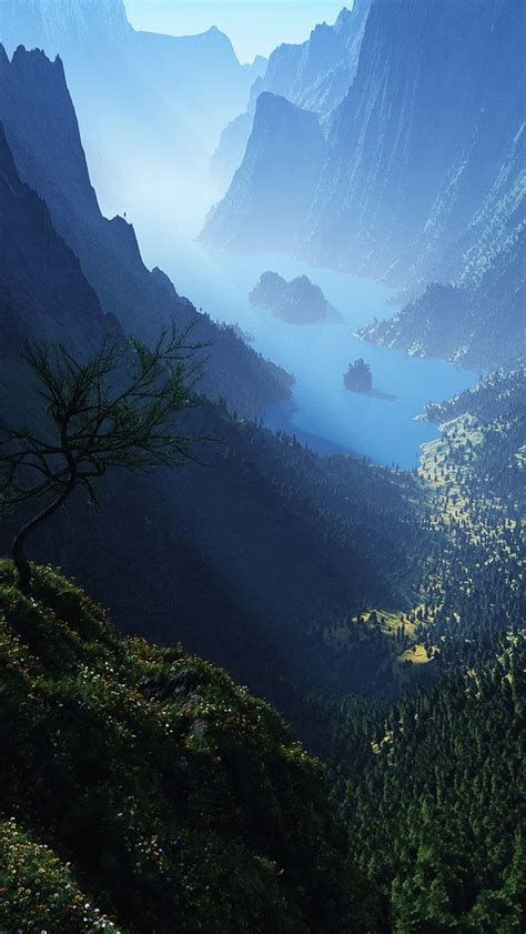 an aerial view of the mountains and water