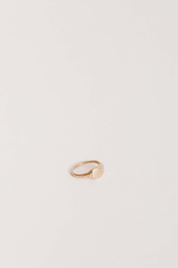 We love a pinky ring and this simple single initial is perfection. Hand engraved in our Charleston, SC studio. Compliment the simplicity of this ring with a horizontal stacking of JP TWIG RINGS or other JP GOLD BANDS. Excluded from all promotions. If you don't see your size, email us at info@janepopejewelry.com Minimalist Adjustable Engraved Open Ring, Minimalist Adjustable Open Engraved Ring, Everyday Simple Design Initial Ring, Simple Initial Promise Ring, Simple Initial Ring For Promise, Simple Initial Ring With Round Band For Promise, Everyday Initial Ring With Simple Round Band, Simple Stackable Initial Ring For Everyday, Minimalist Initial Promise Ring