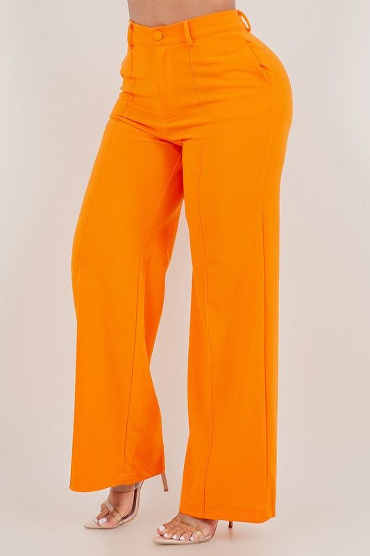 Stand out in style with these vibrant orange pants that are perfect for any occasion. Made from high-quality fabric, these pants offer both comfort and style. Feature 1: High waist design for a flattering fit Feature 2: Front zipper and pockets for added convenience Feature 3: Wide leg for a trendy look Feature 4: Stretchable material for ease of movement Model is wearing a size Large Casual Orange Bottoms, Orange Solid Bottoms For Spring, Orange Solid Color Bottoms For Spring, Bold Straight Pants, Orange Full-length Bottoms With Pockets, Orange Full Length Bottoms With Pockets, High Waist Orange Bottoms, Orange Bottoms For Summer, Orange Solid Color Bottoms For Summer