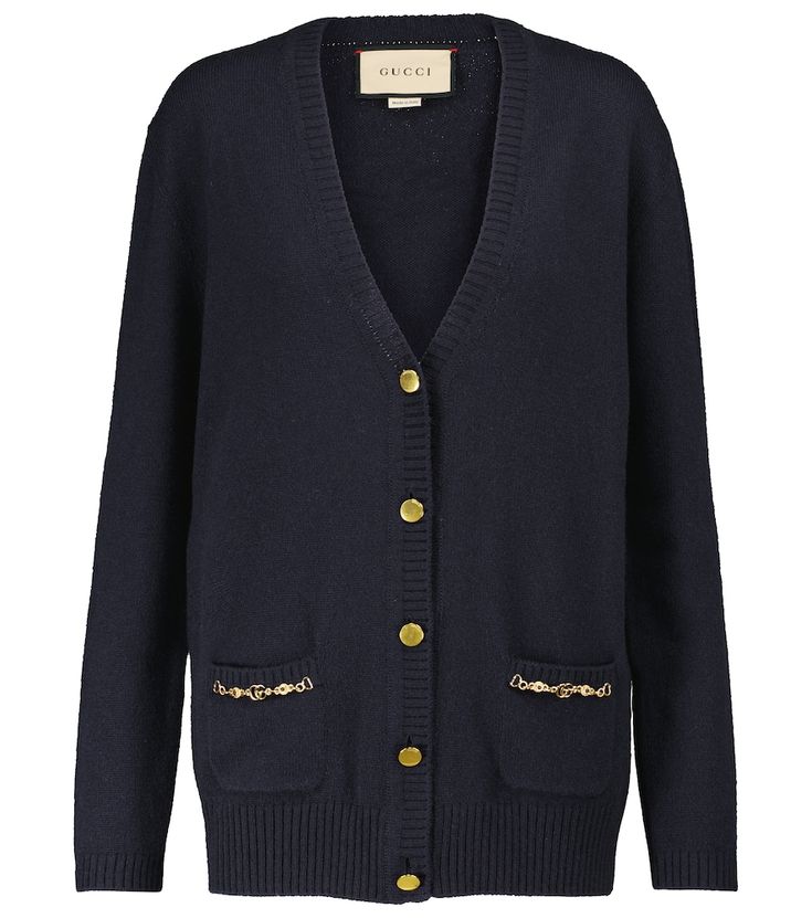 This dark blue cardigan is from Gucci's Ouverture collection, which mixes archival codes with modern silhouettes. It's made in Italy from cashmere and trimmed with golden pocket chains featuring the house's Interlocking G hardware. Gucci Cardigan For Winter Workwear, Gucci Winter Workwear Cardigan, Gucci Long Sleeve Cardigan For Work, Gucci Classic Winter Cardigan, Gucci Long Sleeve Sweater For Work, Classic Gucci Winter Cardigan, Classic Winter Gucci Cardigan, Luxury Cashmere Cardigan With Button Closure, Classic Gucci Fall Cardigan