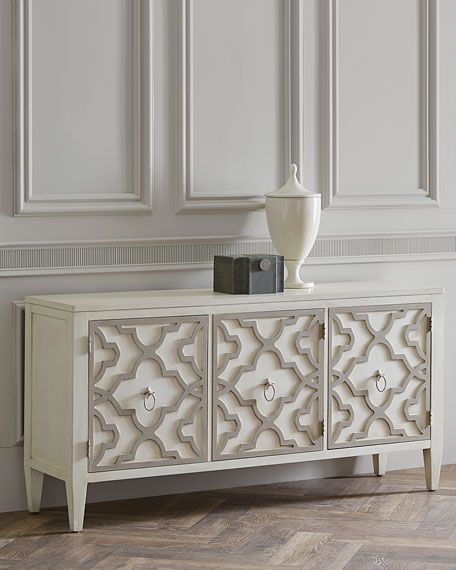 an ornate white sideboard in a room