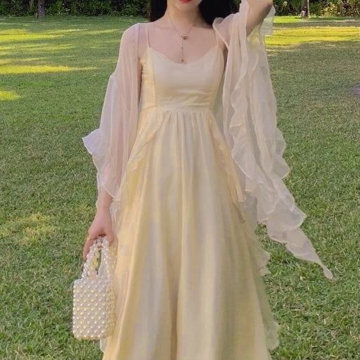 ‘Sandy Light’ is a delicate fairy dress with an empire waist, cascading ruffle accents, revealing neckline and elegant slim shoulder straps. The length is midi, which means below the knee. 2-piece set with a ruffle cardigan is also available for purchase. S Bust: 82cm Empire Waist: 70cm Length: 113cm M Bust 86cm Empire waist: 74cm Length: 114cm L Bust: 90cm Empire waist: 78cm Length: 115cm XL Bust: 94cm Empire Waist: 82cm Length: 116cm Cardigan is in ONE SIZE (free size) Material: Polyester Feminine Dresses Aesthetic, Royal Casual Dress, Angelic Dress Aesthetic, Prom Dress With Cardigan, Ethereal Aesthetic Dress, Ina Core, Flowy Dress Aesthetic, Empire Waist Dress Casual, Empire Waist Prom Dress