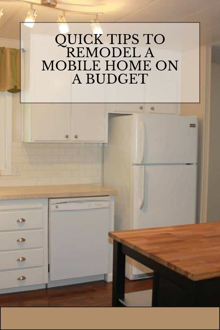 a white refrigerator freezer sitting inside of a kitchen next to a wooden counter top