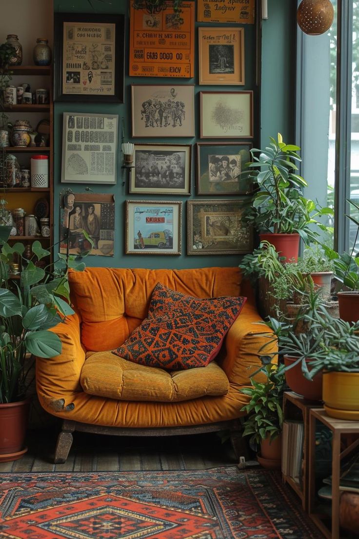 a living room filled with lots of plants and pictures on the wall next to a couch