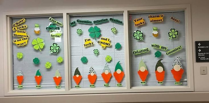 some carrots and broccoli are on the window sill in this classroom