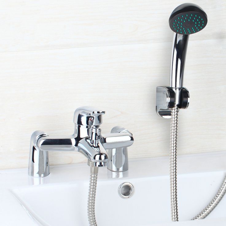 an image of a bathtub faucet with shower head and handset measurements