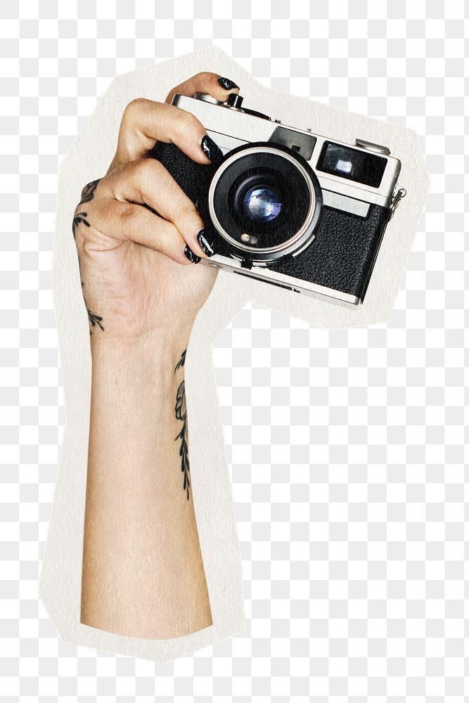 a person holding up a camera in front of their face, with tattoos on her arm