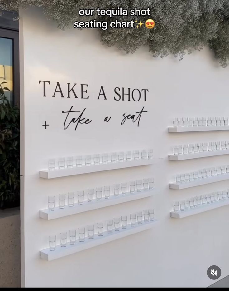 there is a sign that says take a shot and take a bite on the wall