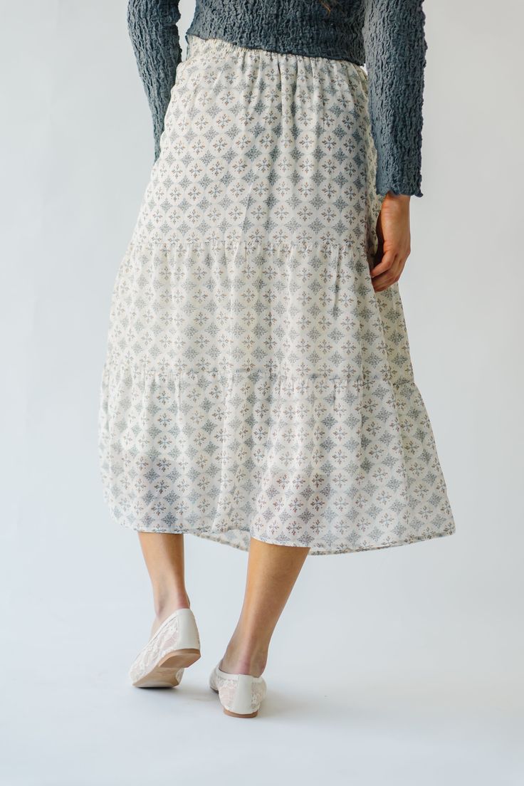 Get ready to twirl in style with the Antosh Tiered Patterned Midi Skirt! This cream-colored skirt features playful tiers and a unique pattern for a fun and quirky look. Perfect for adding personality to any outfit, this skirt will have you feeling confident and stylish. Details self/lining: 100% polyester Fabric Care Guide Here Sizing & Fit Measurements are approximate and taken while laying flat across the front. Not doubled. small: waist = 14"; length = 33" medium: waist = 15"; length = 33" la Spring Flowy Lined Maxi Skirt, Flowy Midi Skirt For Vacation, Flowy Gathered Skirt Bottoms For Day Out, Flowy Skirt With Elastic Waistband For Day Out, Flowy Spring Maxi Skirt With Lining, Flowy Lined Maxi Skirt For Spring, Beach Midi Skirt With Elastic Waistband, Lined Maxi Skirt For Vacation, Flowy Midi Skirt Bottoms For Vacation