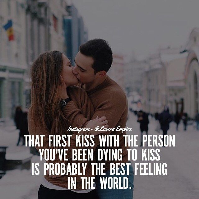 a man and woman kissing in the middle of a city street with a quote on it