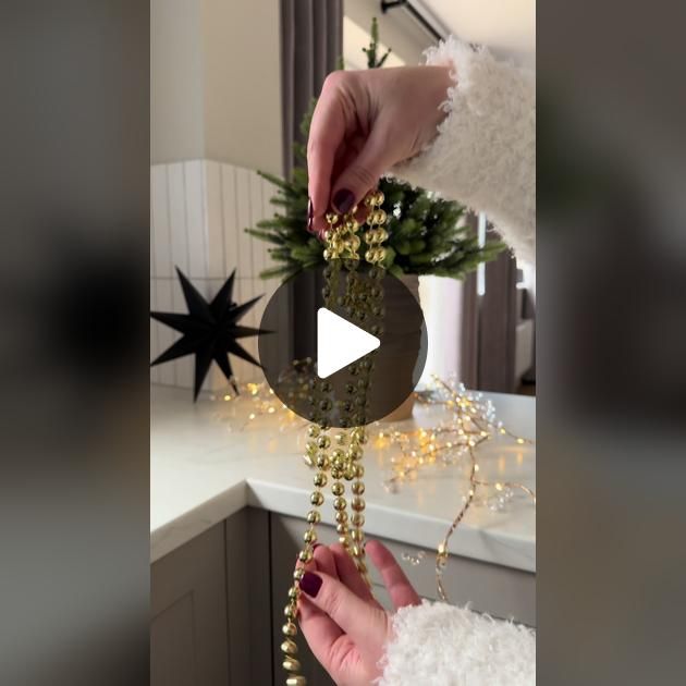 a person is decorating a christmas tree