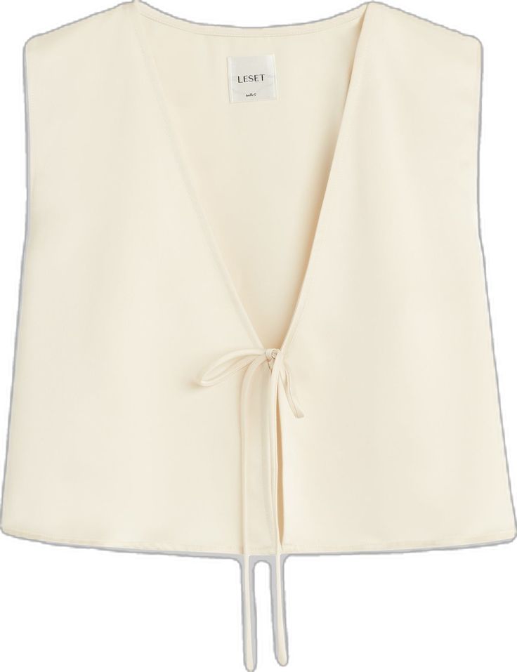 Elegant Summer Tops With Drawstring Tie, Elegant Sleeveless Tops With Tie Waist, Elegant Sleeveless Summer Wrap Top, Elegant Sleeveless Wrap Top For Summer, Chic Spring Wrap Top With Tie Back, Chic Sleeveless Crop Top For Daywear, Elegant Cropped Wrap Top, Elegant Cropped Wrap Top For Summer, Tie Top