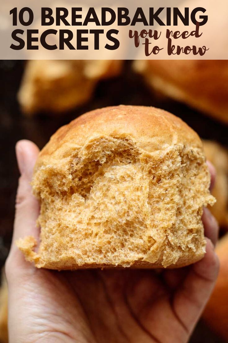 a hand holding a piece of bread with the words 10 bread baking secrets you need to know