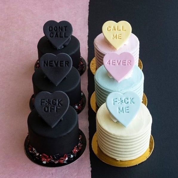 two cakes decorated with hearts and words on top of each other, one for each cake