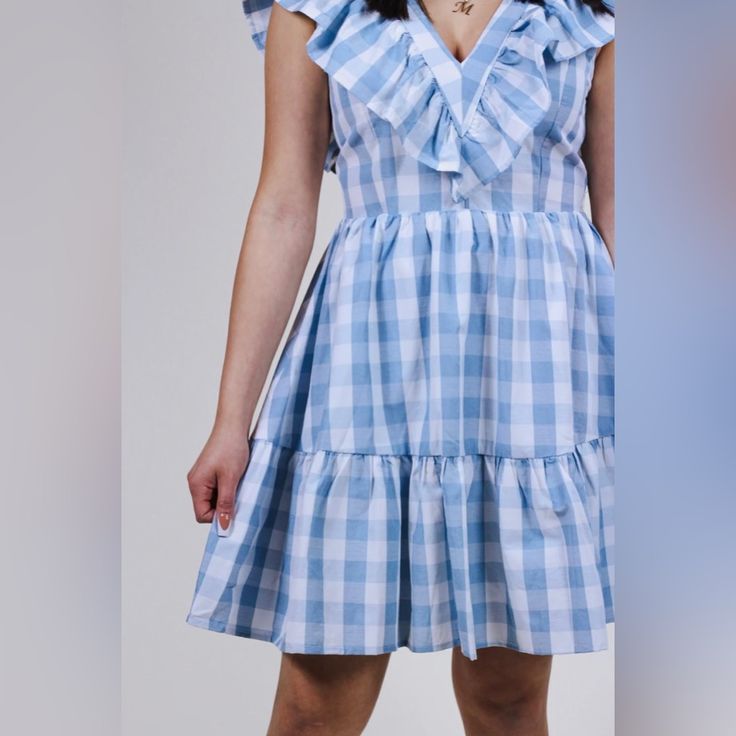 Nwt Entro Set The Tone Gingham Dress Size: Large Color: Pastel Blue And White Description: Gingham Print V-Neck Sleeveless Tiered Mini Dress Featuring Ruffle Detailing. Smocking At Back. Lined Woven Non-Sheer Pit To Pit: 19.5” (Could Perhaps Fit A Medium As Well) Smoke Free Home Ships Same Day Or Next Business Day Bundle And Save! Open To Reasonable Offers! Preppy Short Sleeve Dress For Picnic, Blue Plaid Dress For Spring Day Out, Blue Plaid Dress With Ruffles For Spring, Preppy Plaid Dress For Spring, Preppy Gingham Dress For Picnic, Blue Plaid Dress For Spring Picnic, Blue Plaid Ruffle Dress For Spring, Blue Mini Length Plaid Dress For Spring, Blue Plaid Mini Dress For Spring