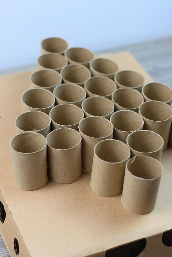 a bunch of empty cups sitting on top of a cardboard box