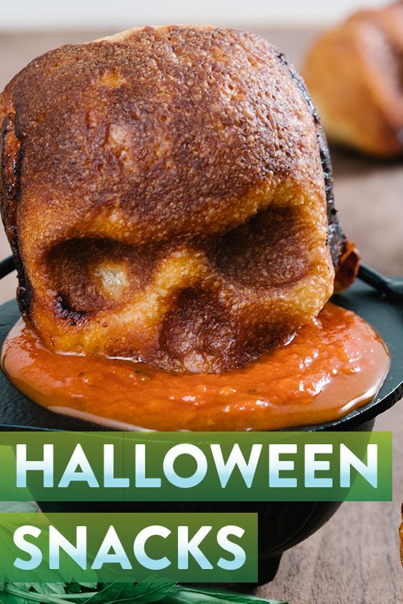 halloween snacks on a black plate with green ribbon around it and the title overlay reads, halloween snacks