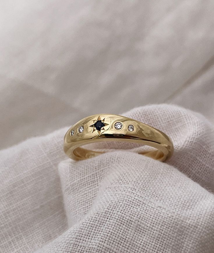 Hand carved Collina band, cast in solid Gold Designed to be worn alone or stacked with other rings from our Monte Collection (as pictured)Band Width: 5.7mm-3.3mm wide approx. (band tapers at the back)Metal: Solid 9ct, 14ct or 18ct Yellow, Rose or White Gold or Platinum Stones: 2mm star set, 2 x 1.5mm + 2 x 1.25mm flush set natural Diamonds or select your favourite stones from the dropdown menu aboveread about our Diamonds here Finishing: High Polished or MattView finishing examples here Payment Star Inspired Engagement Rings, Ring Stack, Handmade Gold Ring, Cute Engagement Rings, Pierced Jewelry, Vs Diamond, Diamond Star, Star Ring, Handmade Gold