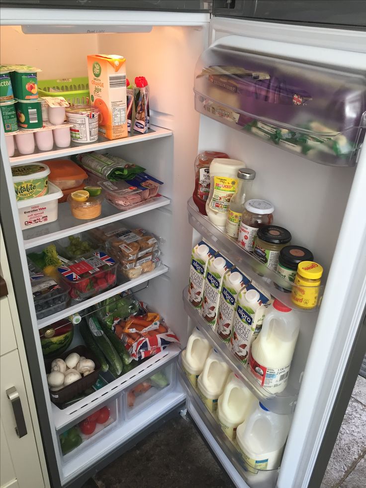 an open refrigerator filled with lots of food