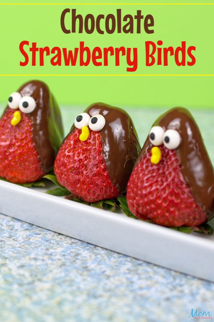 three chocolate covered strawberries in the shape of birds