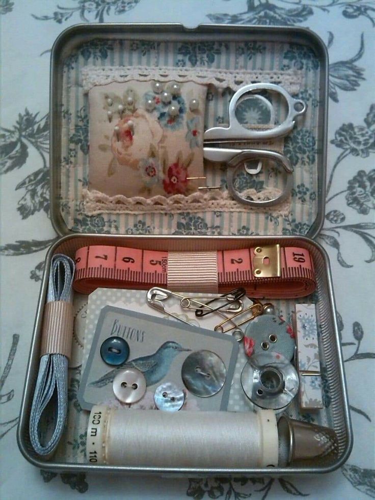 an open suitcase filled with assorted sewing items