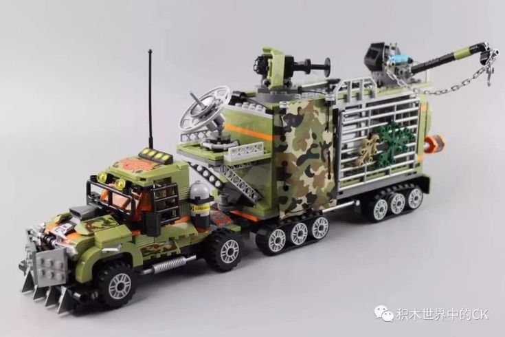 a toy truck that is made out of legos and other things on the back