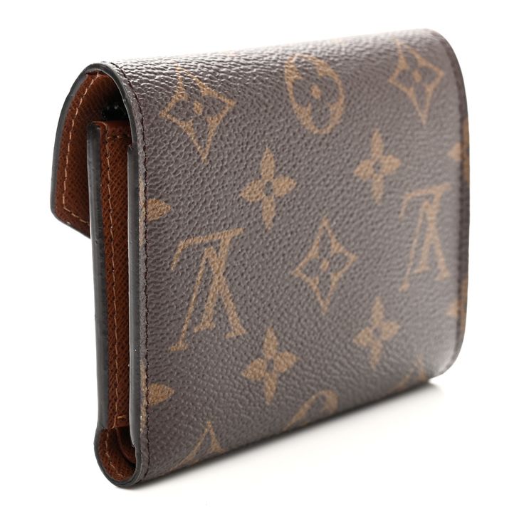 This is an authentic LOUIS VUITTON Monogram Victorine Wallet in Armagnac. This stylish wallet is crafted of traditional Louis Vuitton monogram toile canvas. This wallet features a gold snap closure that opens to a brown crossgrain leather interior with card slots, patch pockets, a bill compartment, and a zipper pocket. Leather Interior, Authentic Louis Vuitton, Louis Vuitton Monogram, Snap Closure, Patch Pocket, Card Slots, Slots, Zipper Pocket, Louis Vuitton