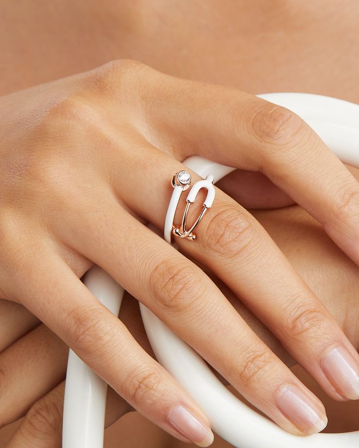 Made in 18K rose gold over brass Hand filled enamel Use our Ring Sizer to find your perfect fit Band height: 14 mm Stone size: 3 mm genuine grade AAA white CZ Christmas Gifts For Med Student, Nurse Jewelry Nursingpin, White Enamel Open Ring For Anniversary, White Enamel Rings With Polished Finish, Elegant Diamond Ring With Enamel, White Diamond Open Ring With Single Diamond, Elegant White Gold Enamel Rings, Formal White Enamel Rings, White Open Ring With Enamel