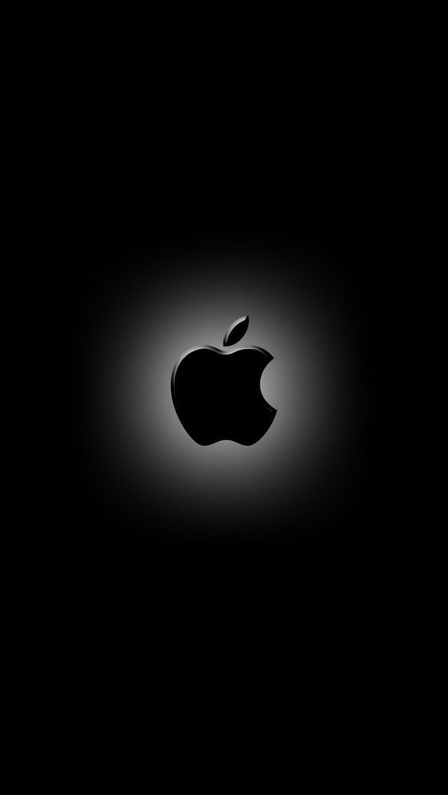 an apple logo is shown in the dark