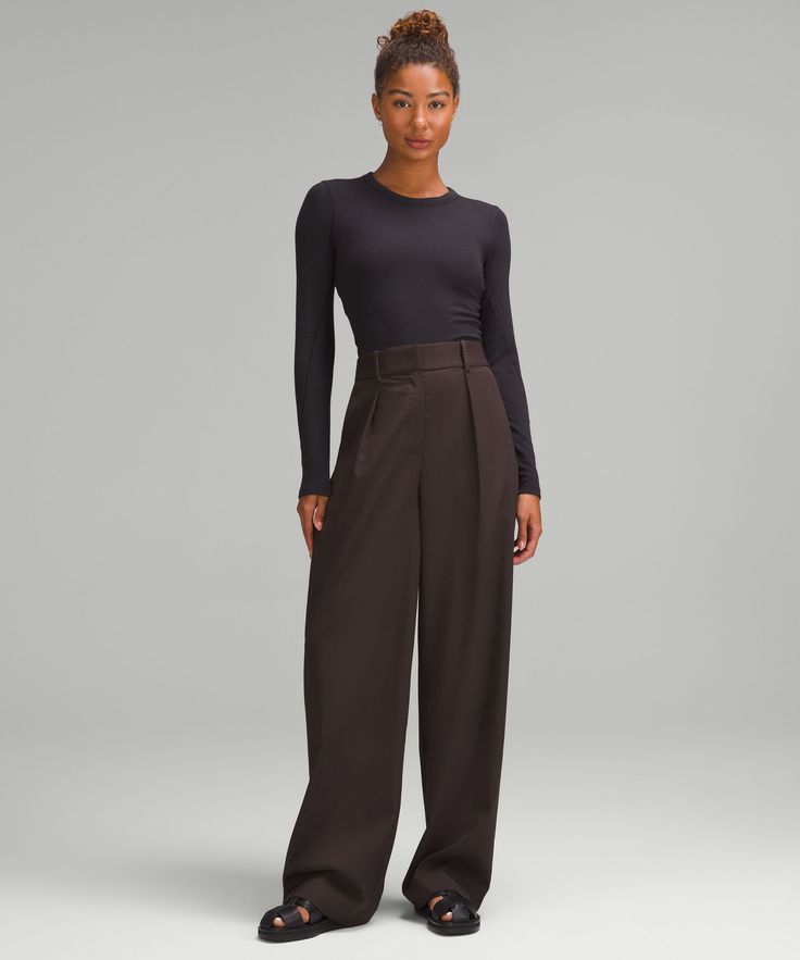 Looking Sharp. These High-Rise Trousers Have Front Pleats And Tailored Details For A Classic Look That Means Business. Designed For Casual. 32.5" Inseam, Intended To Skim The Floor For Heights Of 55"-58":relaxed Fit Is Roomy Through Glutes And Thighs. Hand Pockets With Hidden Card Sleeve. Back Welt Pockets Are Stitched Closed-Snip The Stitches To Make The Pockets Functional. Fly Front. | Pleat-Front High-Rise Trouser Regular Trousers Outfit, Pleated Trousers, Card Sleeve, Pleated Pants, Lululemon Women, Women's Trousers, Welt Pockets, Long Tops, Short Tops