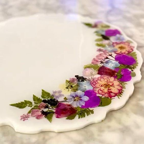 a white plate with purple and pink flowers on it