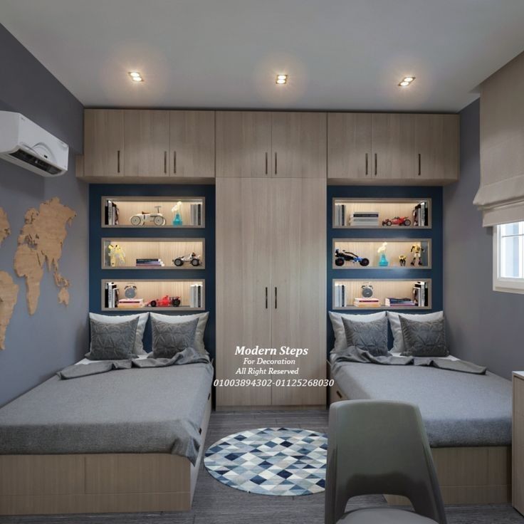 a bedroom with two twin beds and built in shelves