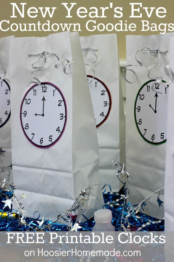 new year's eve countdown goodie bags with free printable clocks on them