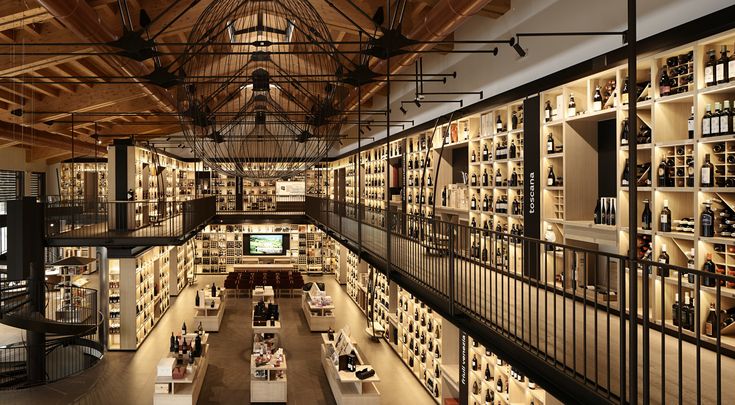 the inside of a wine store with many shelves