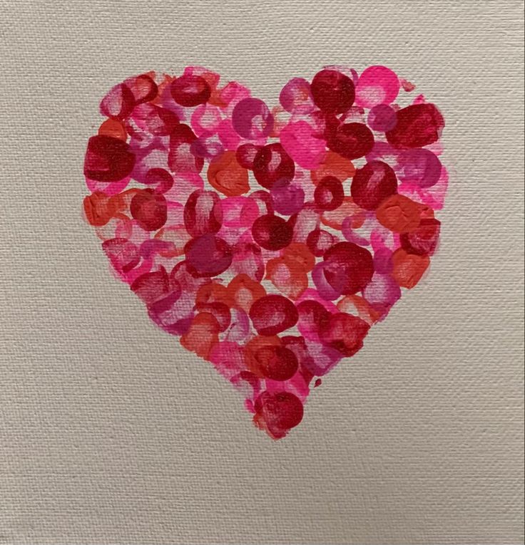 a heart made out of pink and red hearts