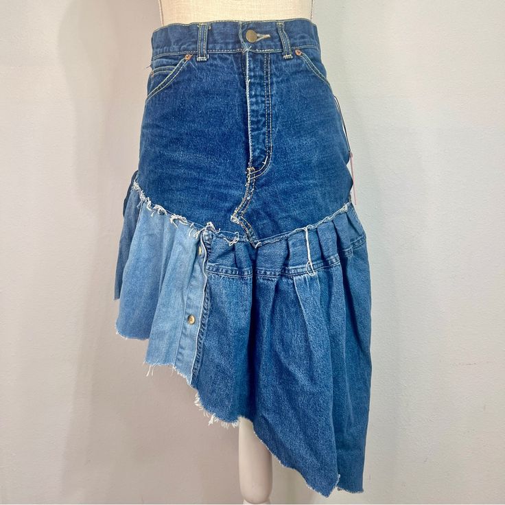 Nwt Urban Renewal By Urban Outfitters Re/Creative Remade Asymmetrical Denim Ruffle Skirt Open To Offers! Enjoy This Asymmetrical Denim Ruffle Skirt, Created From Unique Vintage And Deadstock Items From Around The World. This Is A 1/1 Piece As No Two Are Exactly Alike! Pair This With A Crop Top Or A Graphic Tee For The Perfect Fit!! Check My Store For Any Outfit Additions With Free Shipping On Bundles!! Nwt And Sold Out On The Urban Outfitters Website! Size: Small; Refer To Measurements Below Wai Asymmetrical Cotton Denim Skirt, Asymmetrical Medium Wash Denim Skirt, Asymmetrical Denim Blue Denim Bottoms, Asymmetrical Hem Denim Bottoms In Blue, Asymmetrical Denim Skirt In Denim Blue, Denim Bottoms With Medium Wash And Asymmetrical Hem, Blue Denim Skirt With Asymmetrical Hem, Asymmetrical Hem Denim Bottoms, Denim Blue Asymmetrical Hem Skirt