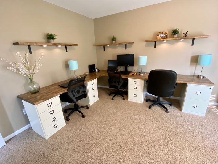 an office with two desks and three chairs